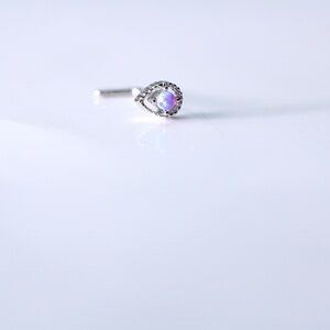 Cute surgical steel nose piercing with an opal ball New